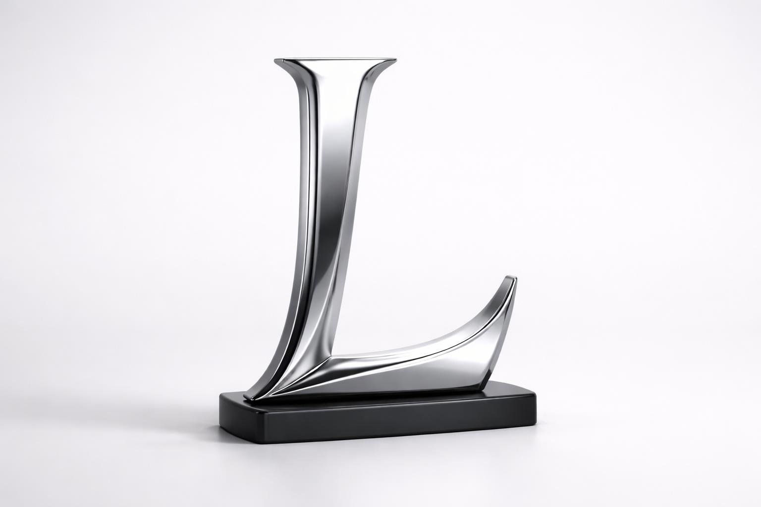 Objeto tridimensional com formato da letra L sobre base preta em fundo branco.